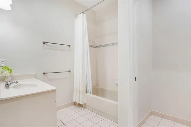 a bathroom with a bathtub and a sink