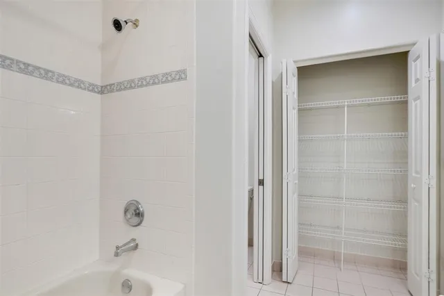 a bathroom with a glass shower door