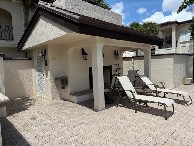 a backyard of a house with lots of green space and fountain