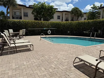 a view of a swimming pool with a patio