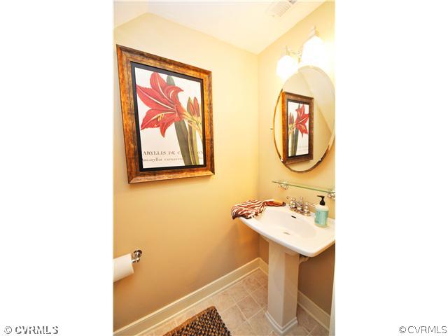 13912 Turtle Hill Road Midlothian, VA 23112 - Photo 8 of 24 a bathroom with a sink and a mirror