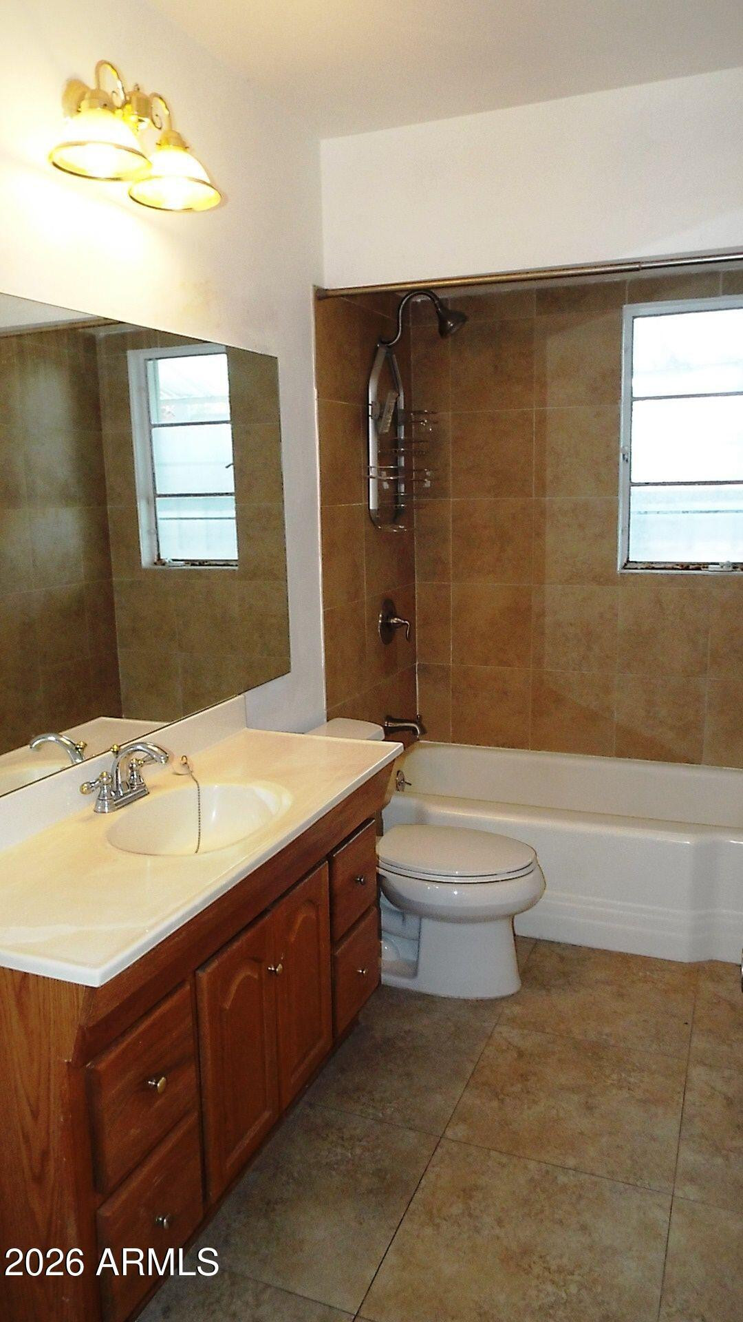 4331 North 20th Street Phoenix, AZ 85016 - Photo 12 of 13 a bathroom with a sink a toilet and shower