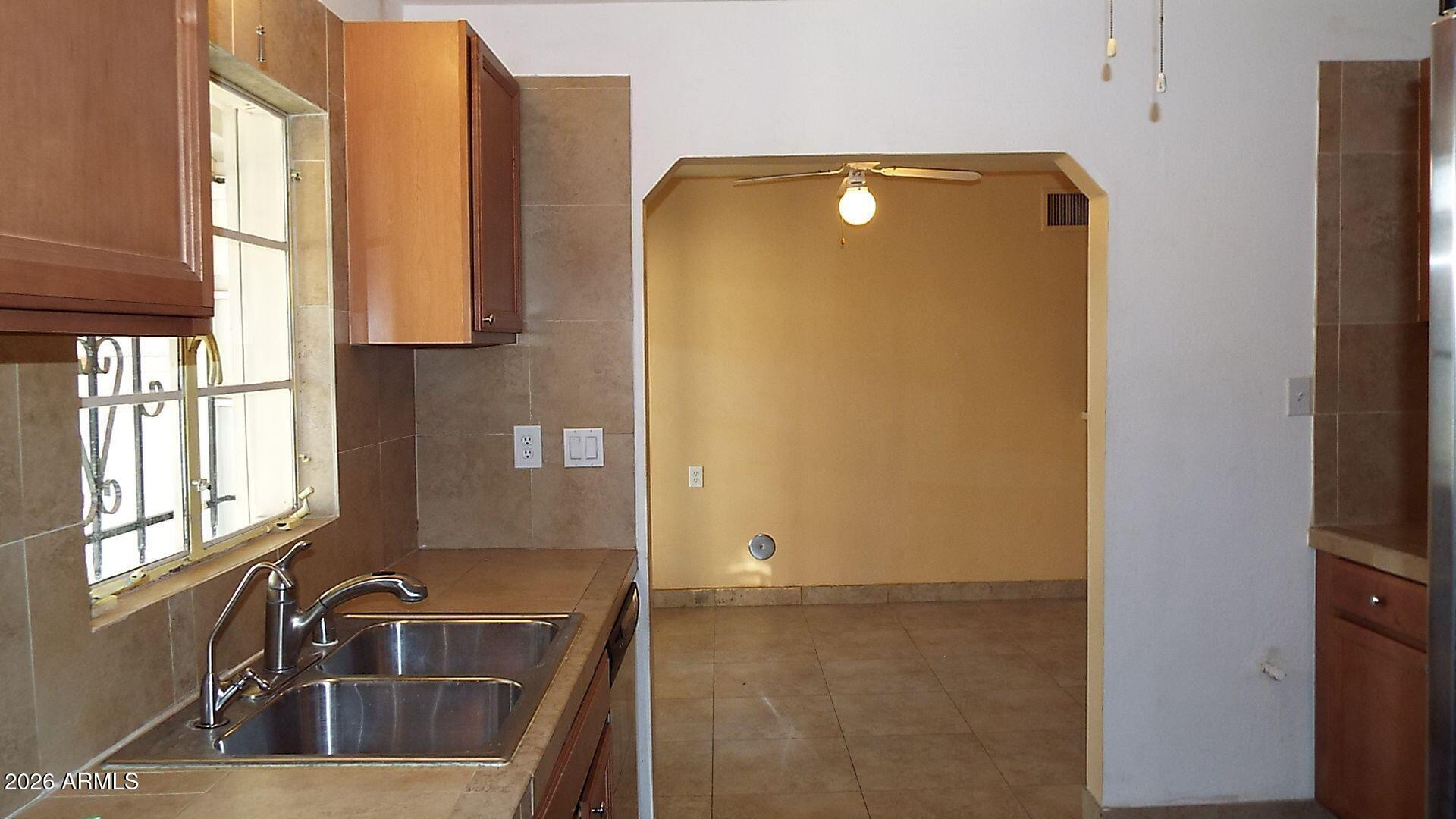 4331 North 20th Street Phoenix, AZ 85016 - Photo 4 of 13 a bathroom with a sink and a large mirror