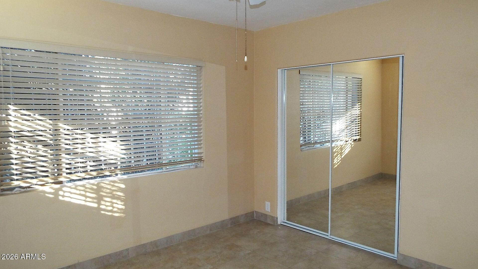 4331 North 20th Street Phoenix, AZ 85016 - Photo 8 of 13 a view of an empty room with a window