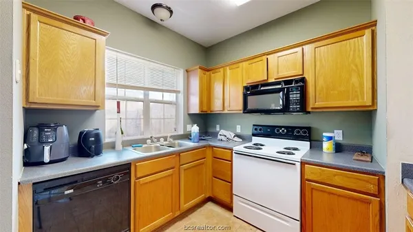 a kitchen with a refrigerator and countertop