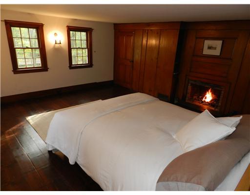 362 Mill Road Stamford, CT 06903 - Photo 13 of 20 a bedroom with a bed and a lamp