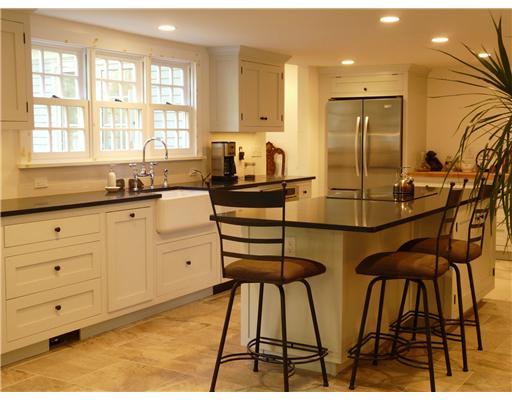 362 Mill Road Stamford, CT 06903 - Photo 6 of 20 a kitchen with stainless steel appliances kitchen island granite countertop a stove a sink and a refrigerator