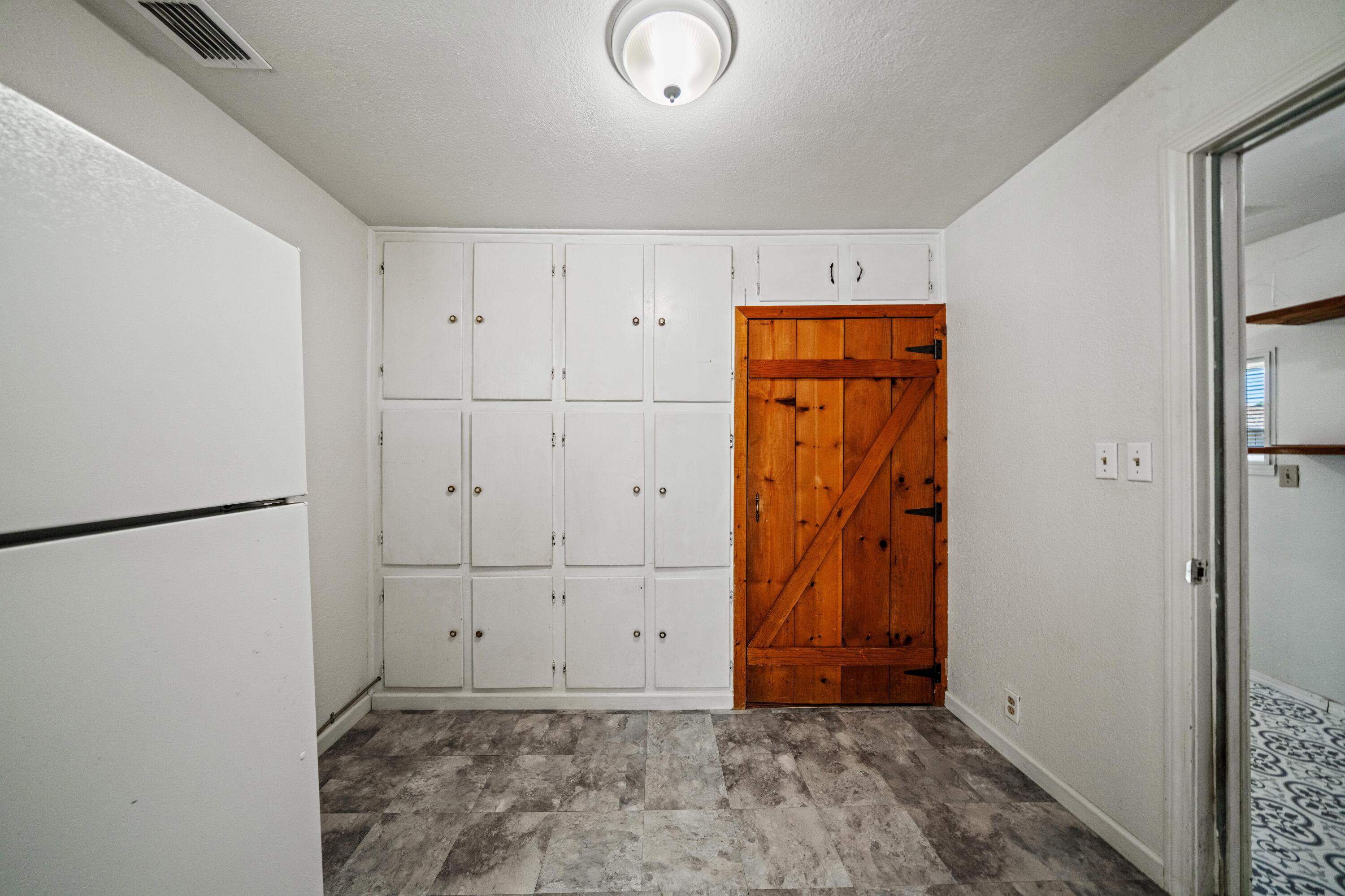 19825 Gas Point Road Cottonwood, CA 96022 - Photo 16 of 54 a view of room with walk in closet and wooden floor