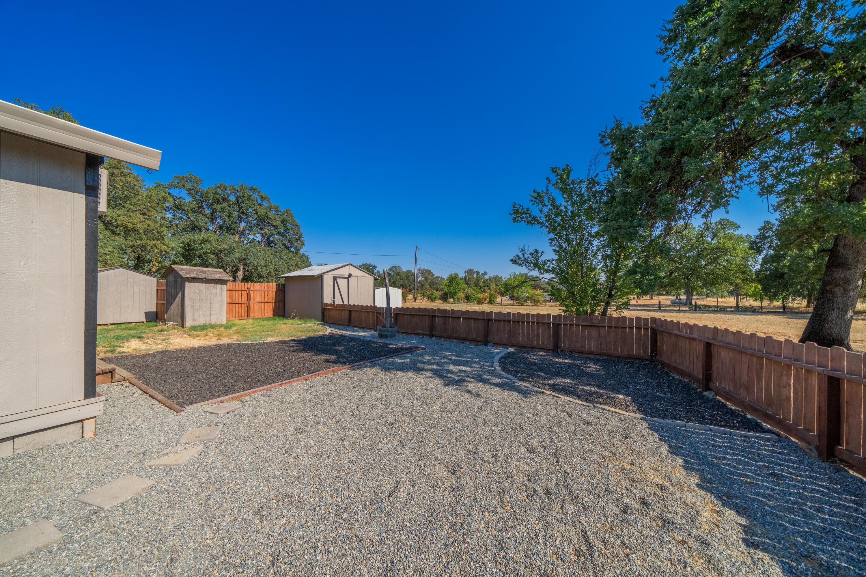 19825 Gas Point Road Cottonwood, CA 96022 - Photo 32 of 54 a view of a house with wooden fence