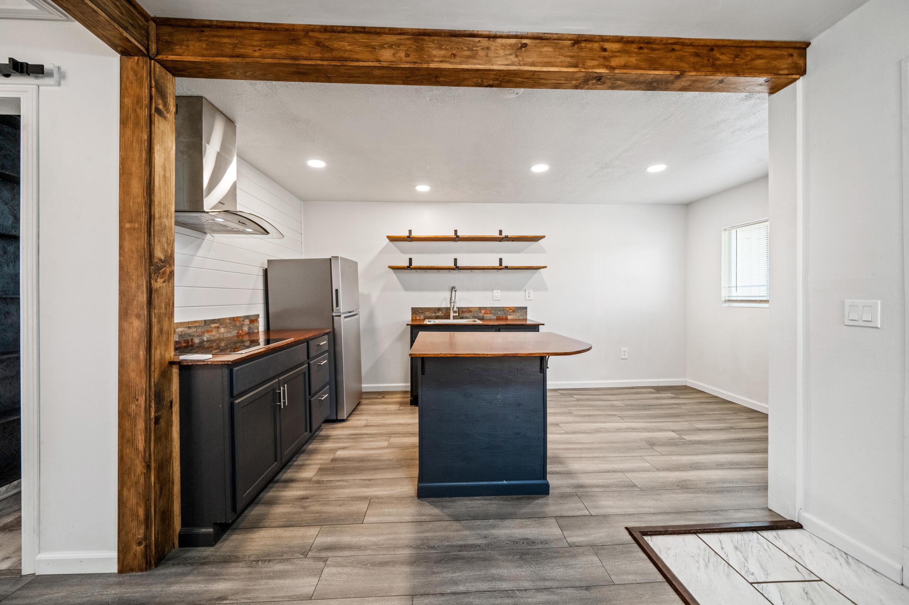 19825 Gas Point Road Cottonwood, CA 96022 - Photo 36 of 54 a kitchen with granite countertop a refrigerator and a stove