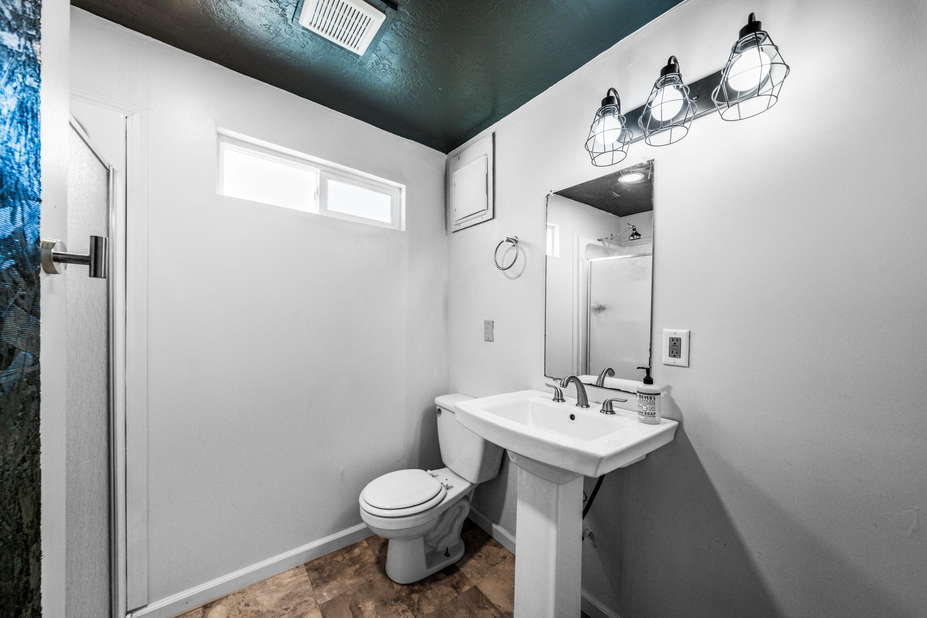 19825 Gas Point Road Cottonwood, CA 96022 - Photo 44 of 54 a bathroom with a toilet sink and mirror