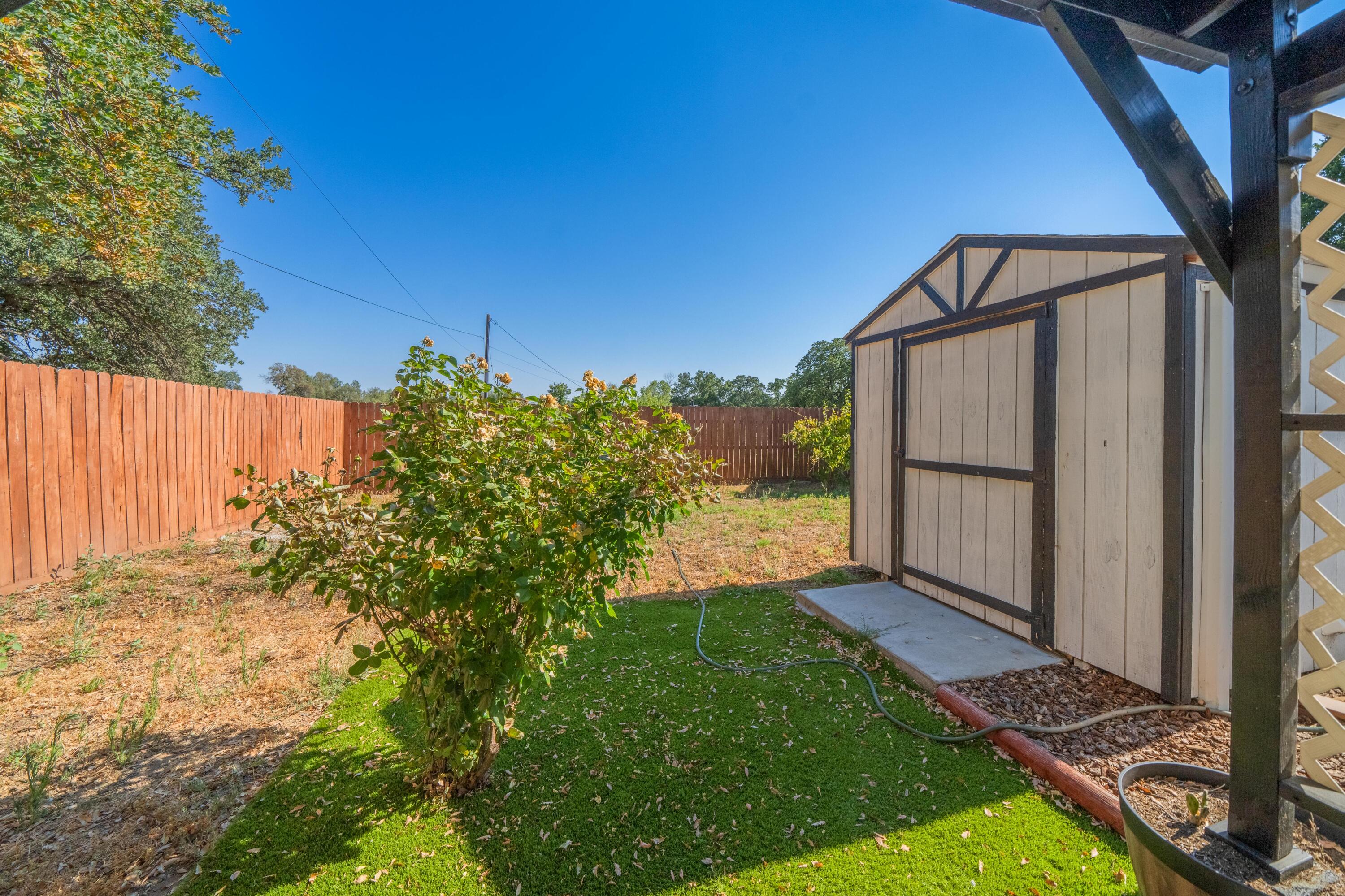 19825 Gas Point Road Cottonwood, CA 96022 - Photo 48 of 54 a view of a backyard with pathway