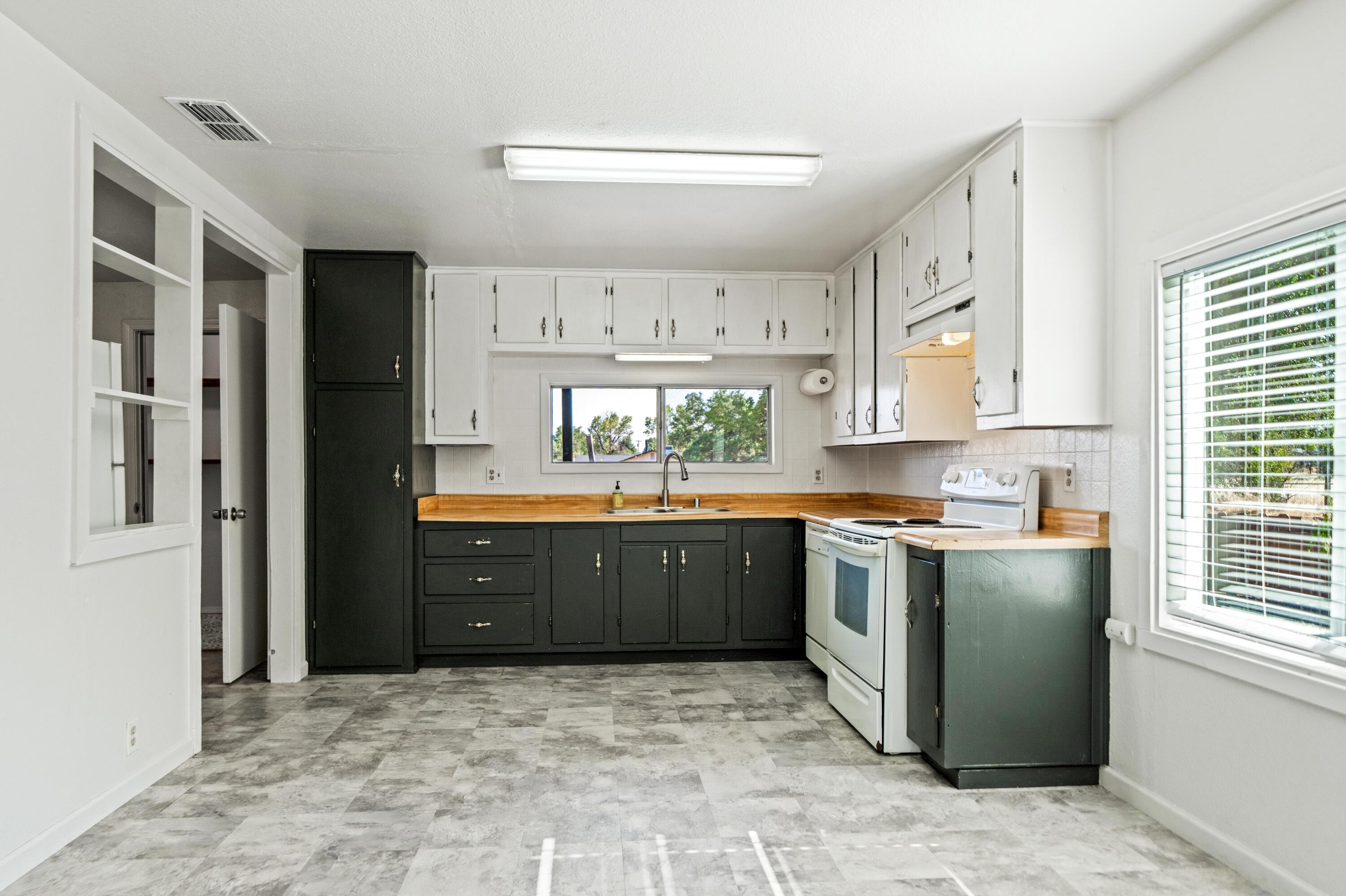 19825 Gas Point Road Cottonwood, CA 96022 - Photo 10 of 54 a kitchen with stainless steel appliances granite countertop a refrigerator and a stove top oven
