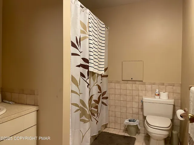 a bathroom with a toilet and sink