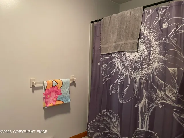 a bed with a book shelf