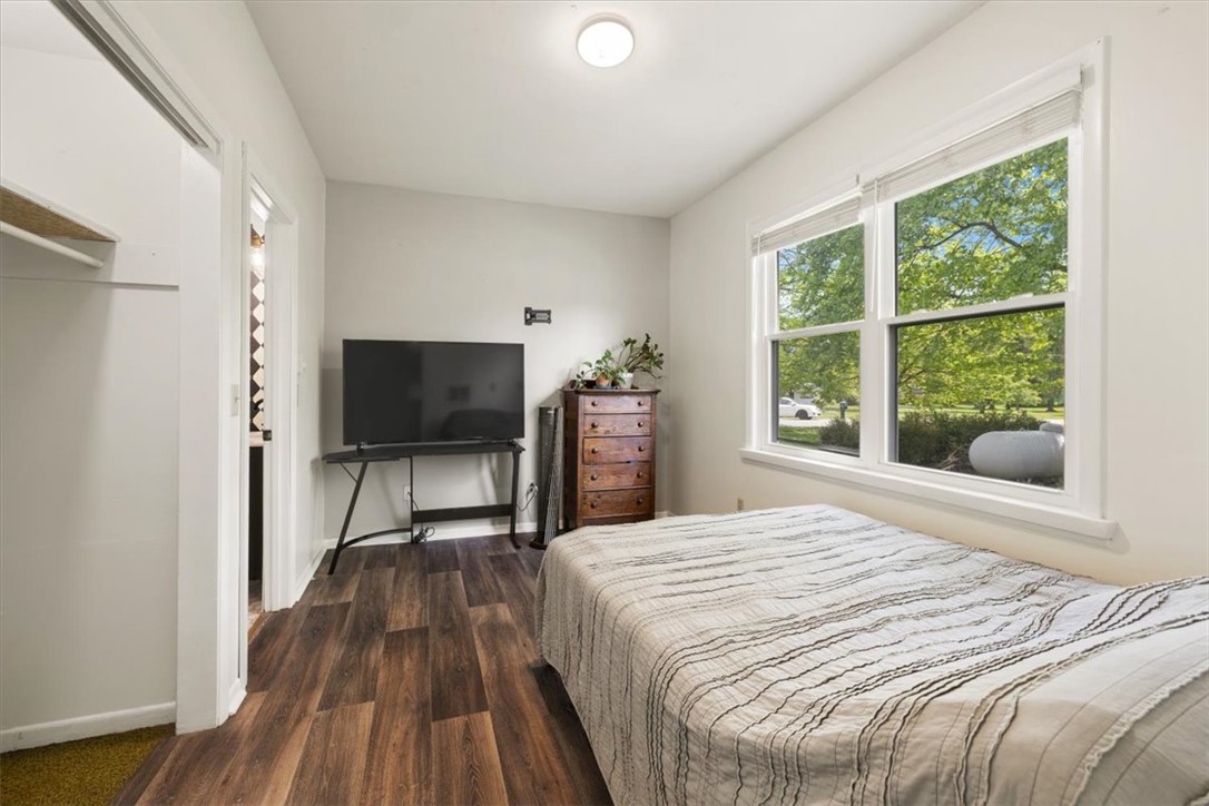 5120 Wheelock Road Troy, OH 45373 - Photo 21 of 67 This cozy bedroom features durable wood-look flooring and ample natural light through its large window.