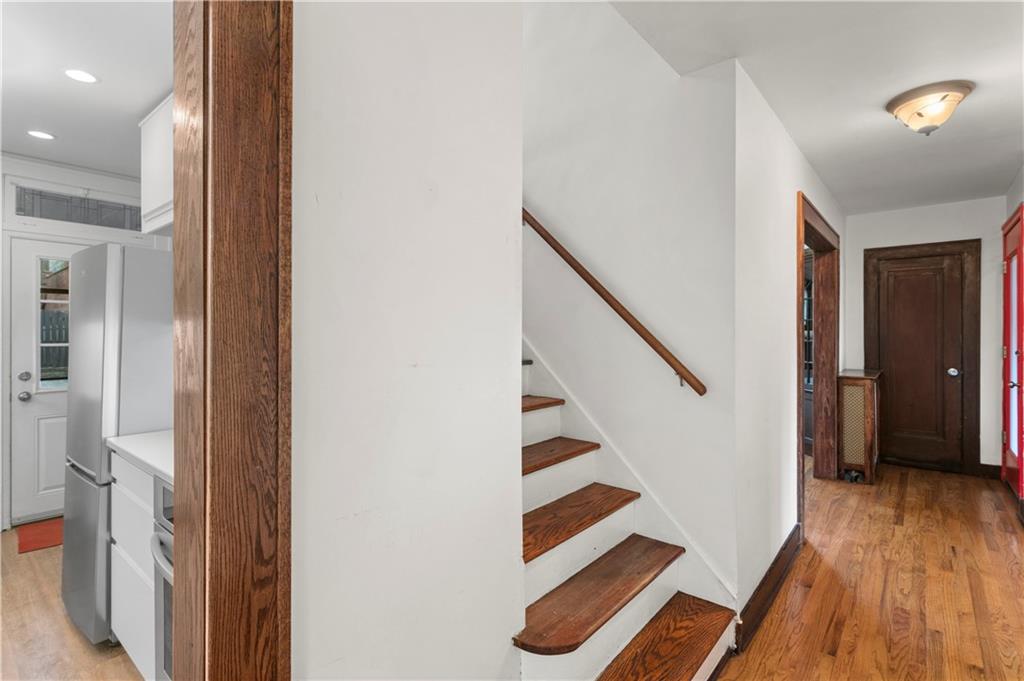 6953 Reynolds Street Pittsburgh, PA 15208 - Photo 14 of 50 a view of entryway and hall with wooden floor