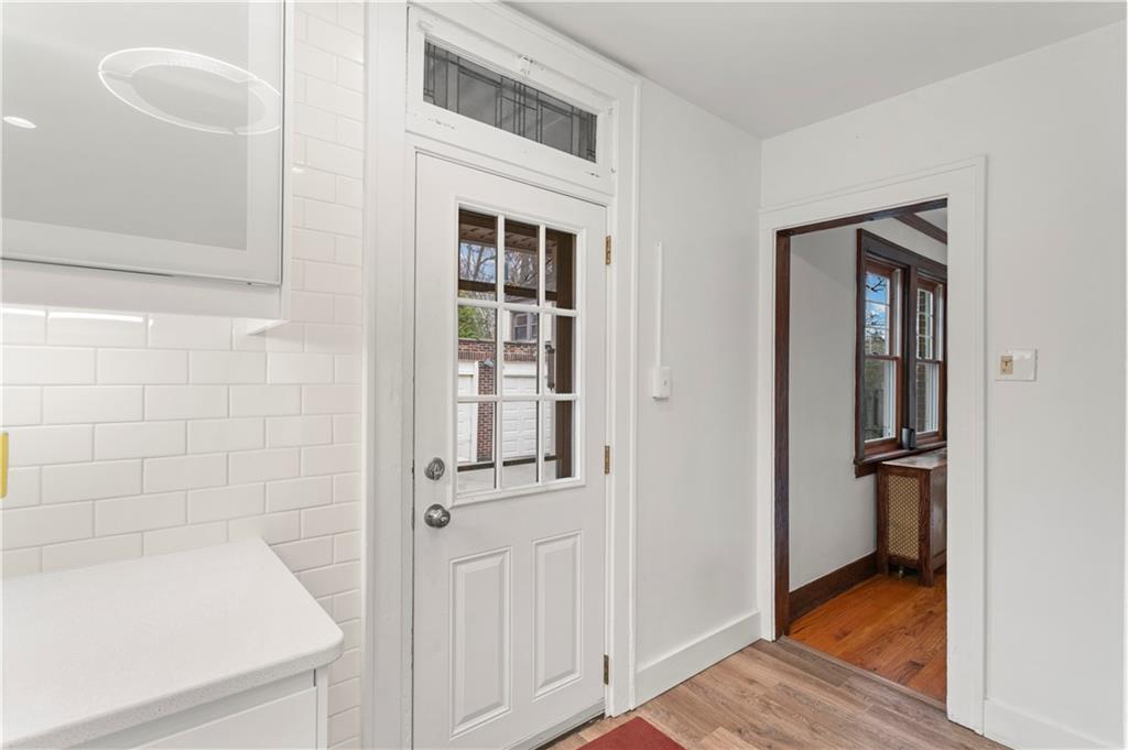 6953 Reynolds Street Pittsburgh, PA 15208 - Photo 21 of 50 a view of a hallway with wooden floor and a bathroom