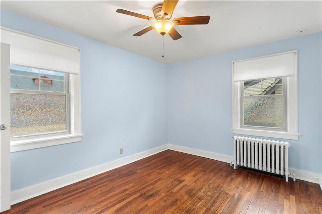 6953 Reynolds Street Pittsburgh, PA 15208 - Photo 25 of 50 a view of empty room with wooden floor and fan