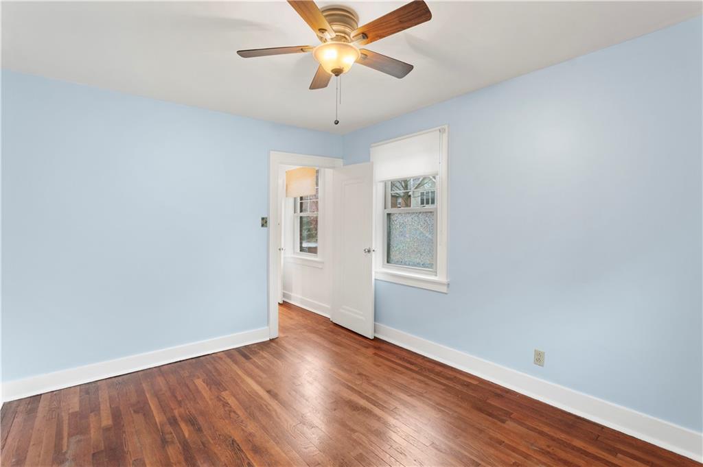 6953 Reynolds Street Pittsburgh, PA 15208 - Photo 26 of 50 wooden floor in an empty room with a window
