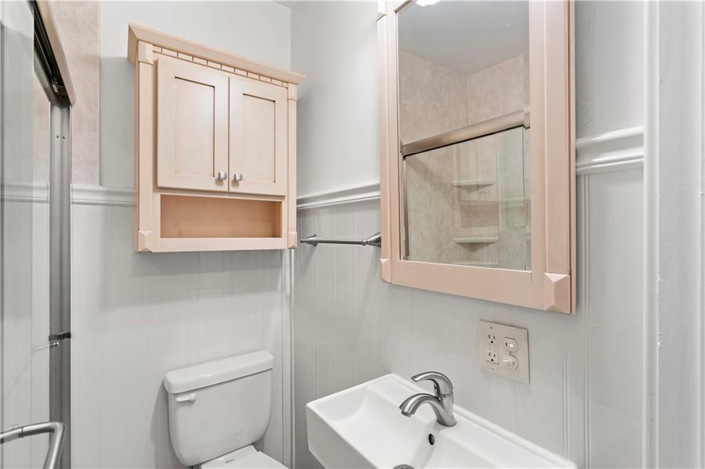 6953 Reynolds Street Pittsburgh, PA 15208 - Photo 28 of 50 a bathroom with a sink a toilet and shower