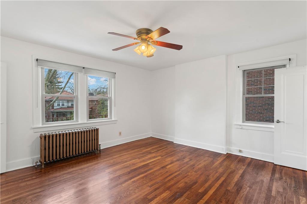 6953 Reynolds Street Pittsburgh, PA 15208 - Photo 32 of 50 wooden floor in an empty room with a window