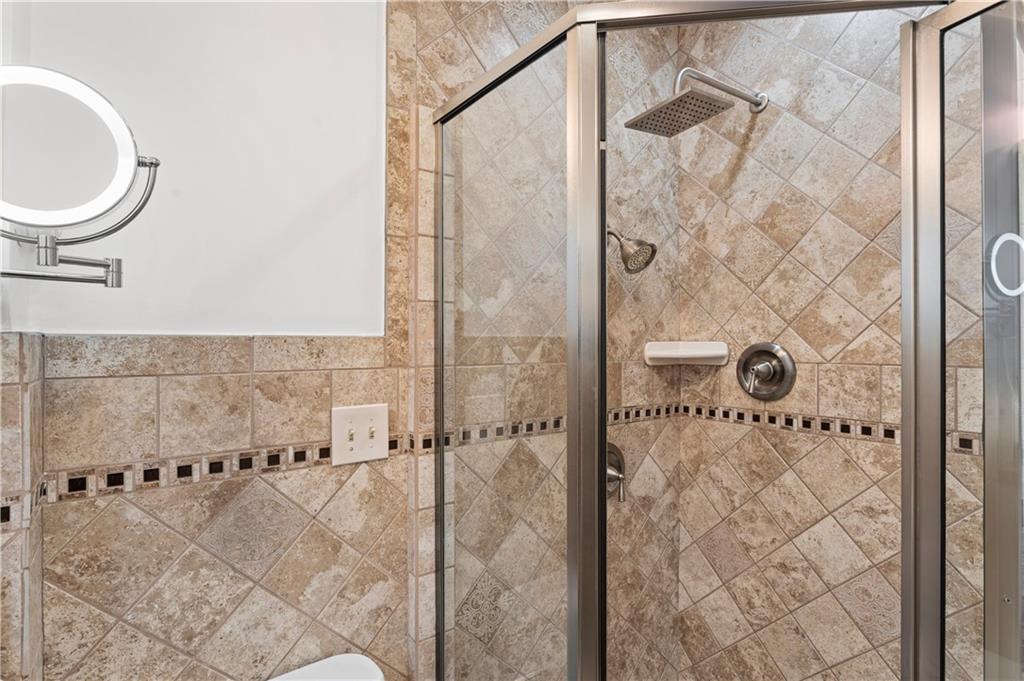 6953 Reynolds Street Pittsburgh, PA 15208 - Photo 35 of 50 a bathroom with a bathtub and shower