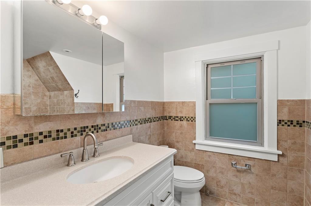6953 Reynolds Street Pittsburgh, PA 15208 - Photo 41 of 50 a bathroom with a sink a toilet and shower