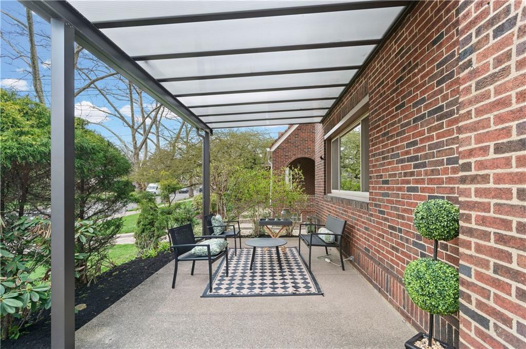 6953 Reynolds Street Pittsburgh, PA 15208 - Photo 46 of 50 a view of patio with a table and chairs and potted plants