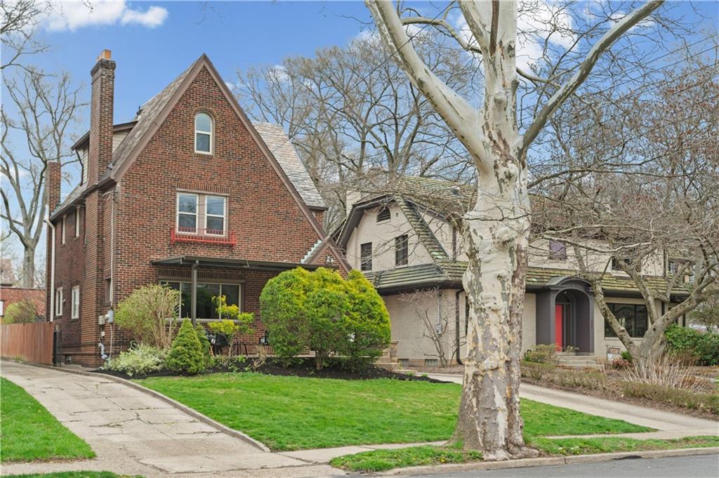 6953 Reynolds Street Pittsburgh, PA 15208 - Photo 49 of 50 a front view of a house with a yard