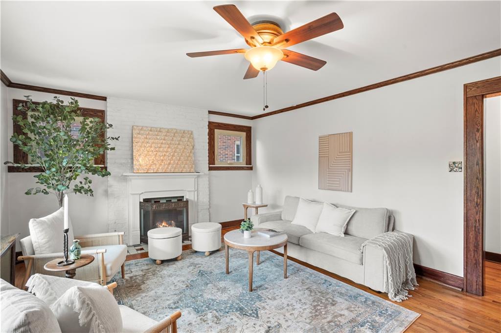 6953 Reynolds Street Pittsburgh, PA 15208 - Photo 5 of 50 a living room with furniture a ceiling fan and a window