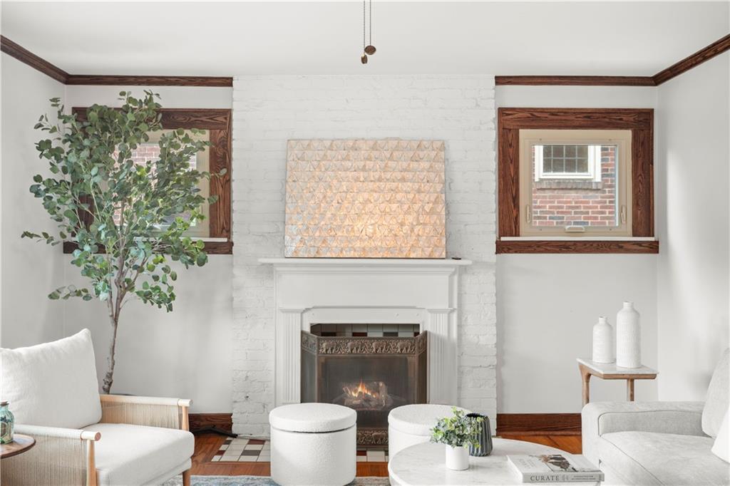 6953 Reynolds Street Pittsburgh, PA 15208 - Photo 8 of 50 a living room with furniture a window and a fireplace