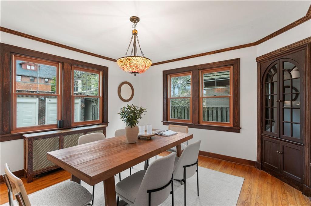 6953 Reynolds Street Pittsburgh, PA 15208 - Photo 10 of 50 a view of a dining room with furniture window and wooden floor