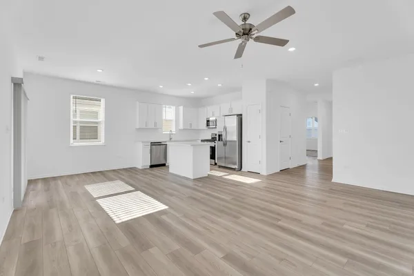 a view of kitchen with granite countertop cabinets and wooden floor