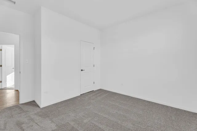 an empty room with wooden floor