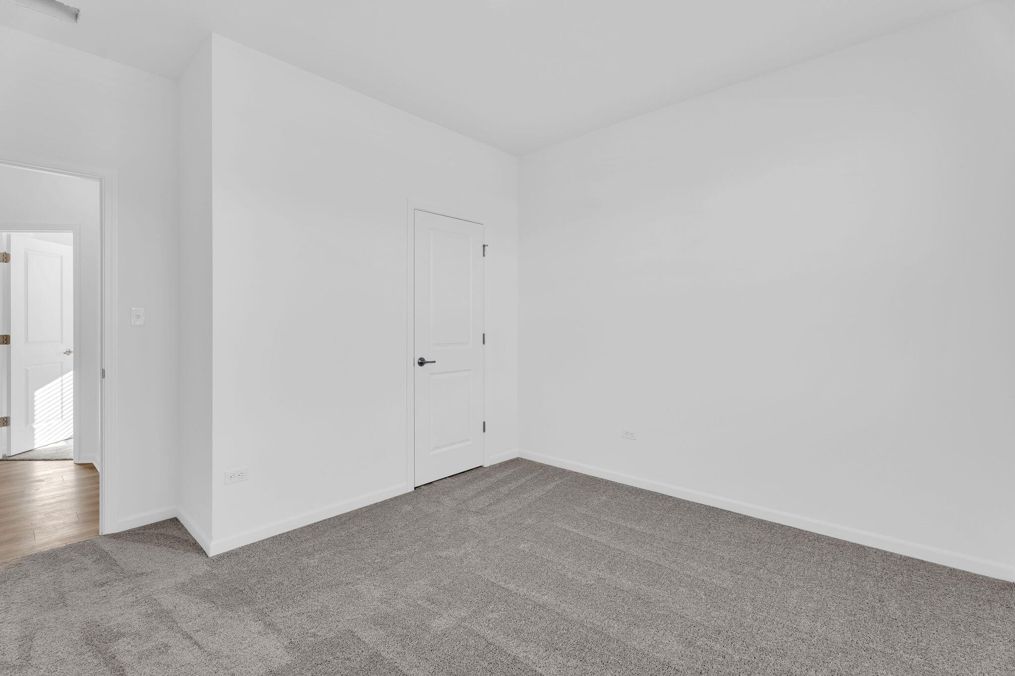 12535 Virginia Street Crown Point, IN 46307 - Photo 7 of 16 an empty room with wooden floor