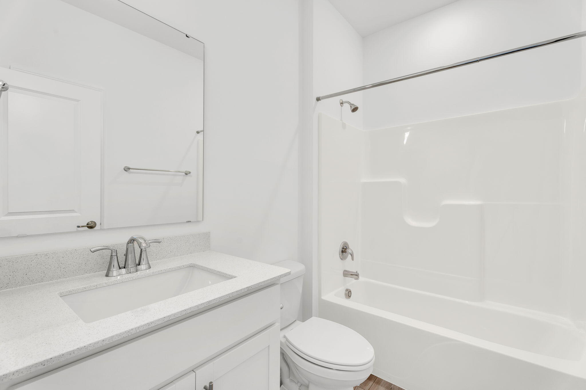 12535 Virginia Street Crown Point, IN 46307 - Photo 8 of 16 a bathroom with a granite countertop sink toilet and shower