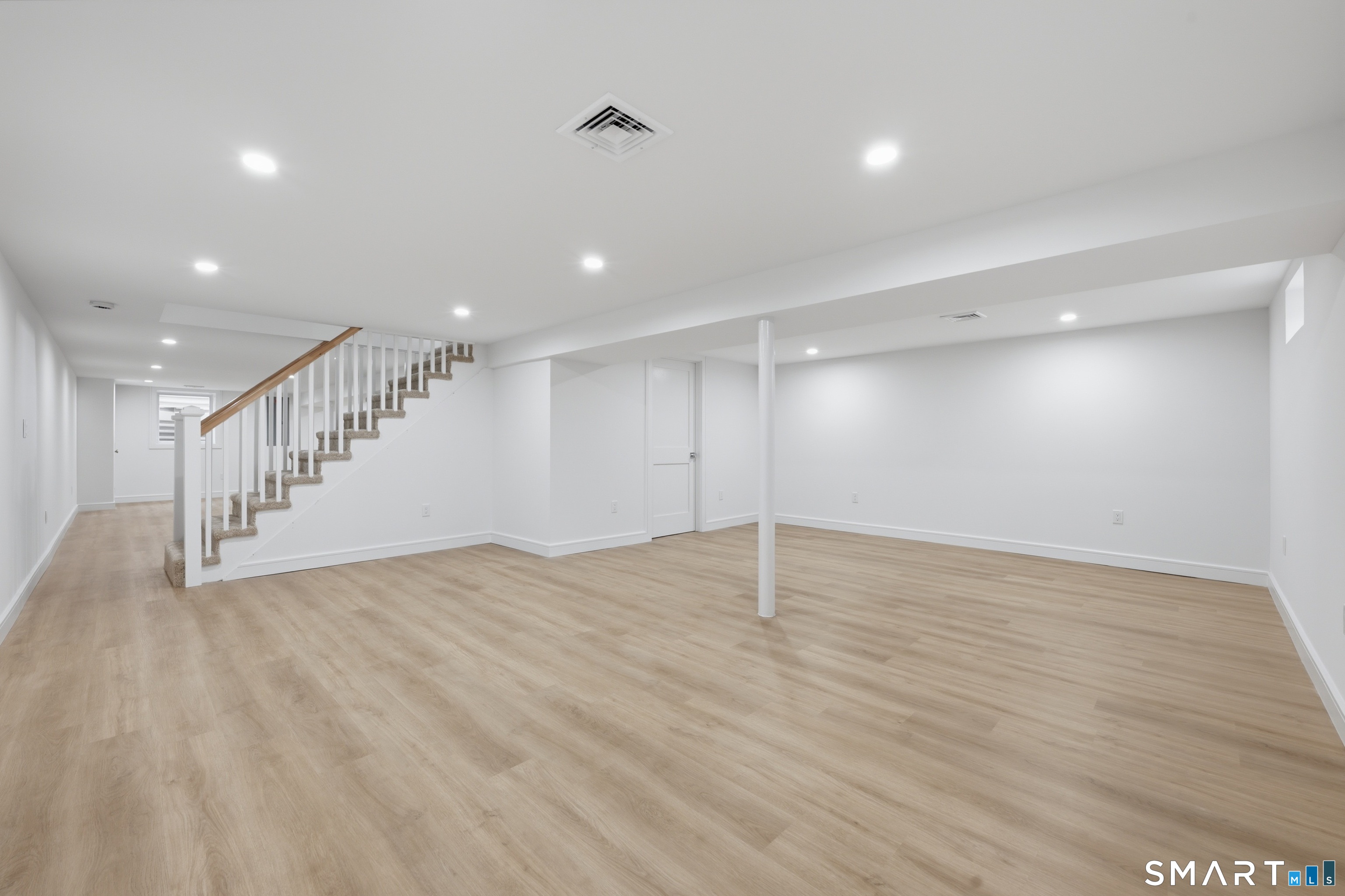 110 Russell Road Stratford, CT 06614 - Photo 24 of 31 a view of an empty room with wooden floor