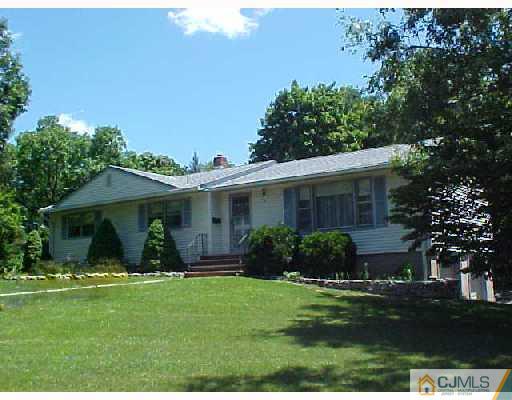 6 Kings Road East Brunswick, NJ 08816 - Photo 1 of 1 a front view of house with a garden