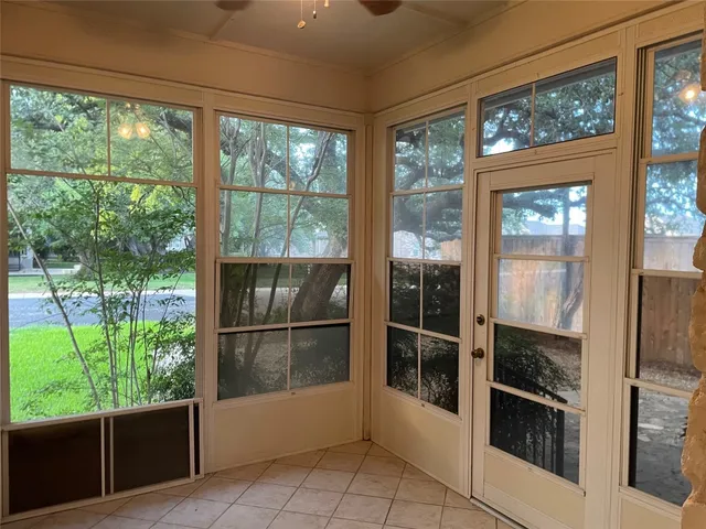a room with a large window and an outdoor view