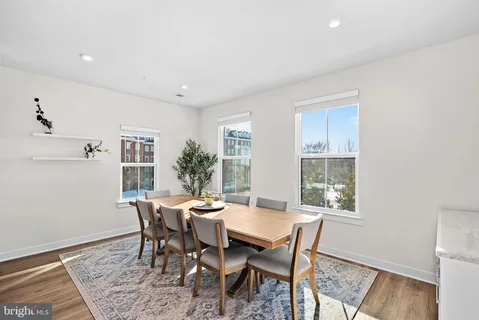 a view of a dining room with furniture and window