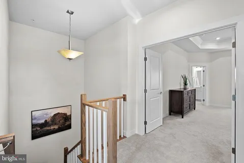 a view of a hallway with a chandelier