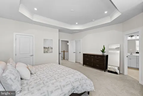 a bedroom with a bed and dresser