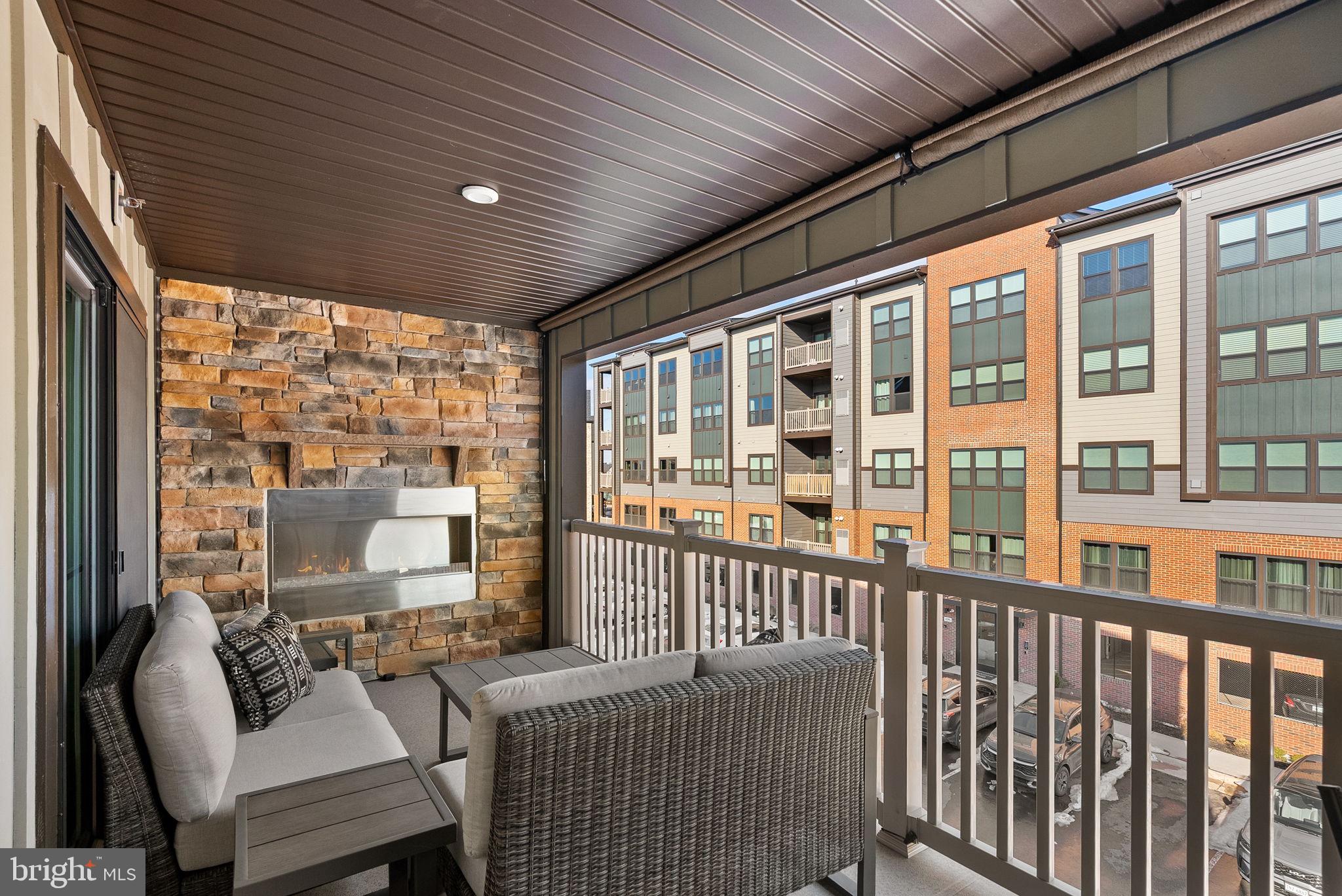 14522 George Carter Way Chantilly, VA 20151 - Photo 27 of 32 Covered Balcony w/Stone Fireplace
