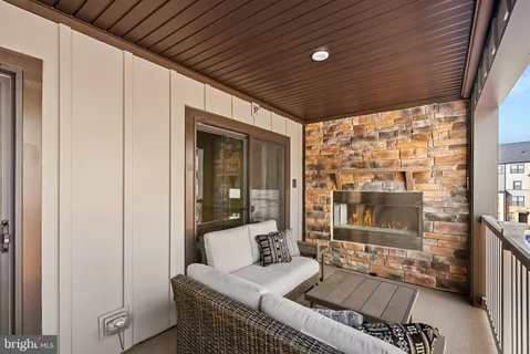 a outdoor space with patio the couches and a dining table with garden view