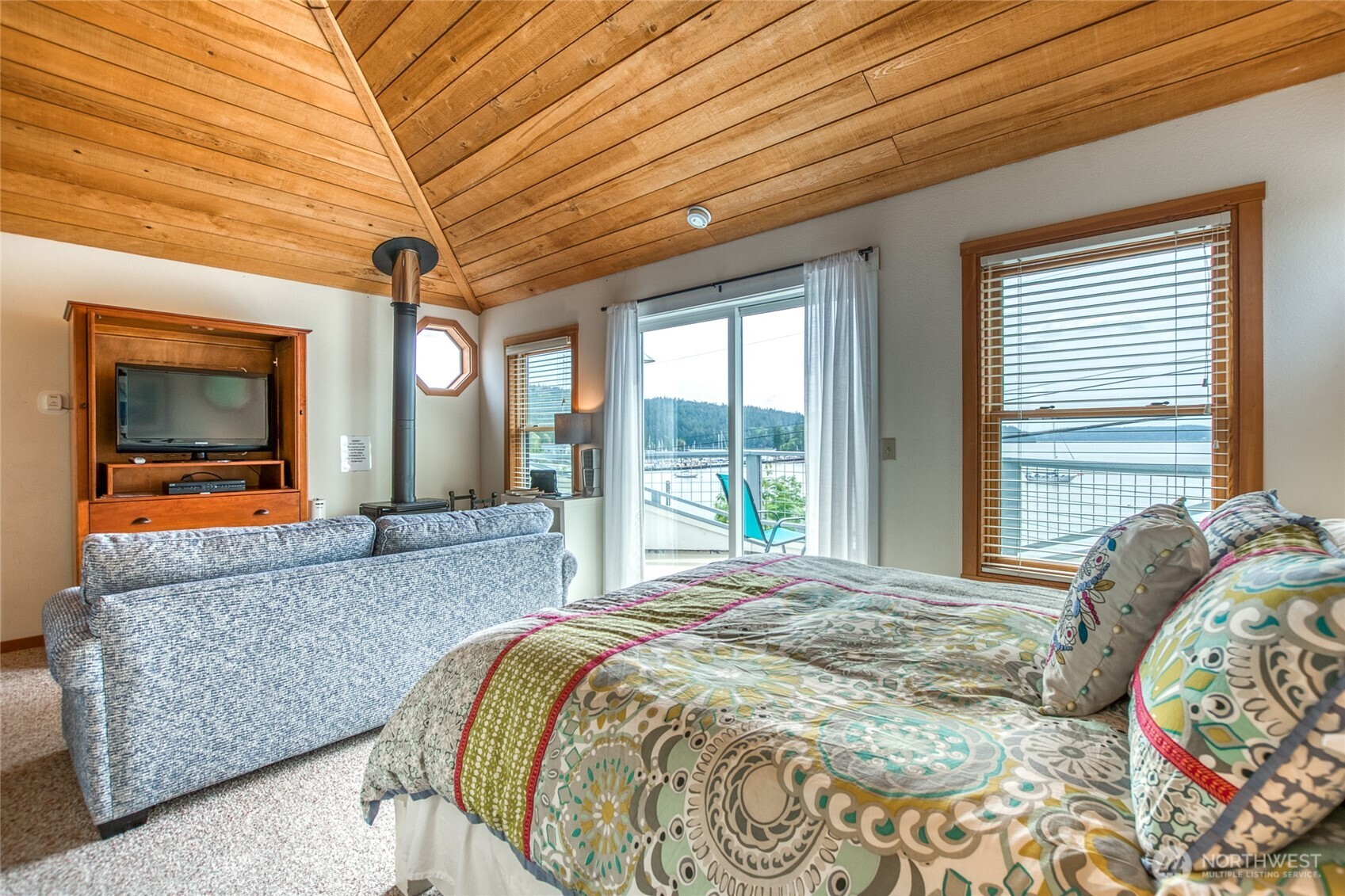 942 Deer Harbor Road Orcas Island, WA 98245 - Photo 29 of 40 a bed sitting in a bedroom next to a window