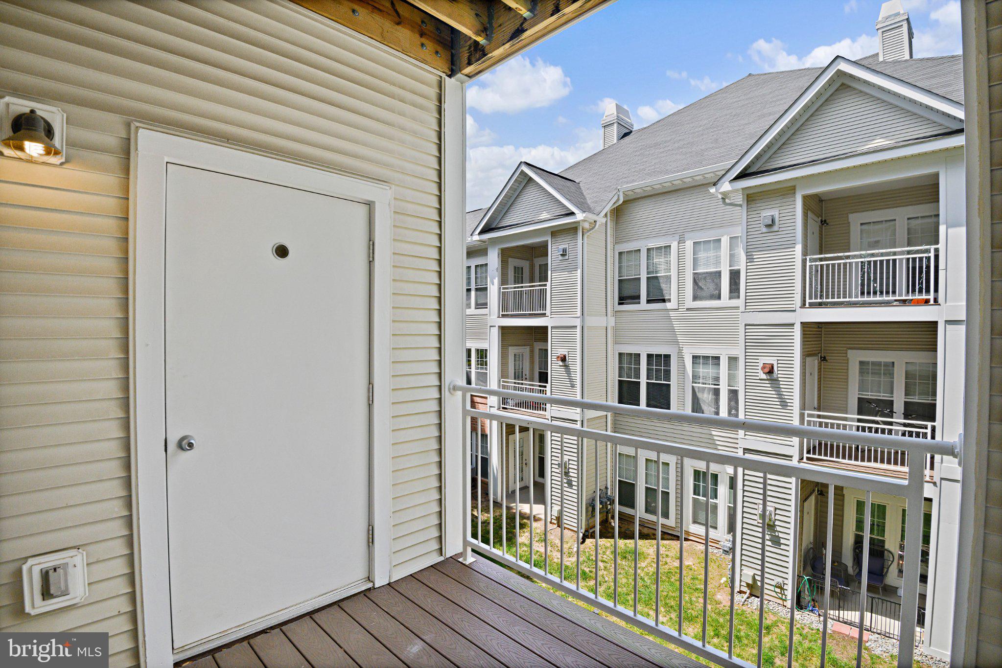 1519 North Point Drive, Unit 202 Reston, VA 20194 - Photo 37 of 49 Charming balcony with serene views.