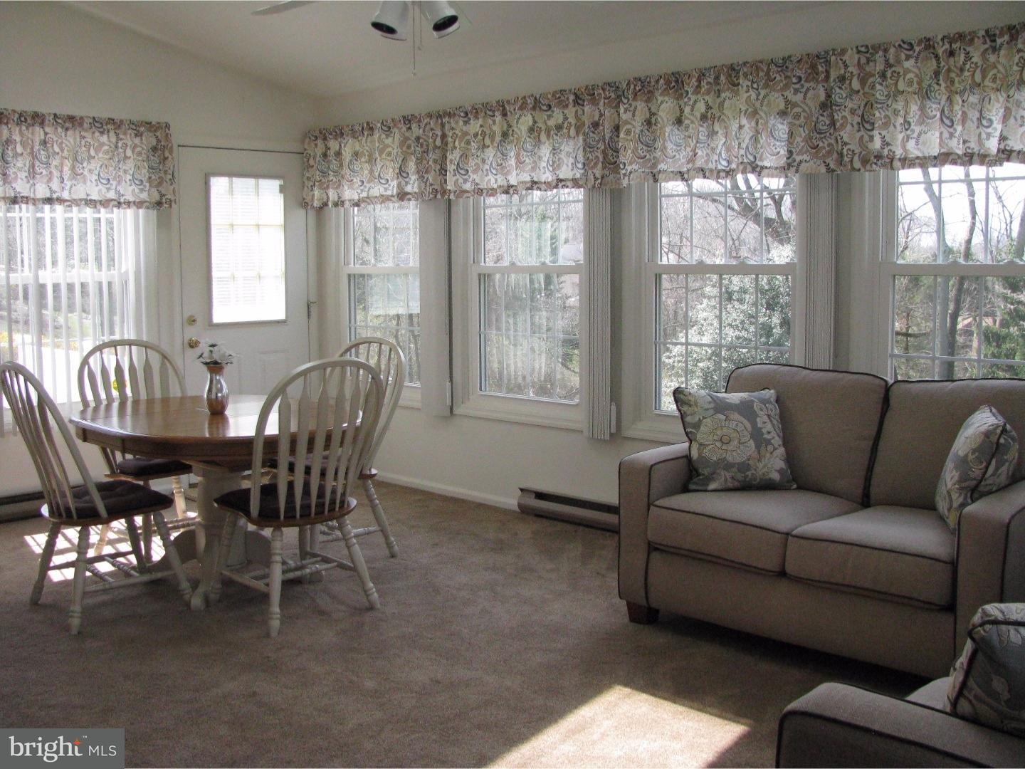 11 Raphael Road Hockessin, DE 19707 - Photo 11 of 25 a living room with furniture and a large window