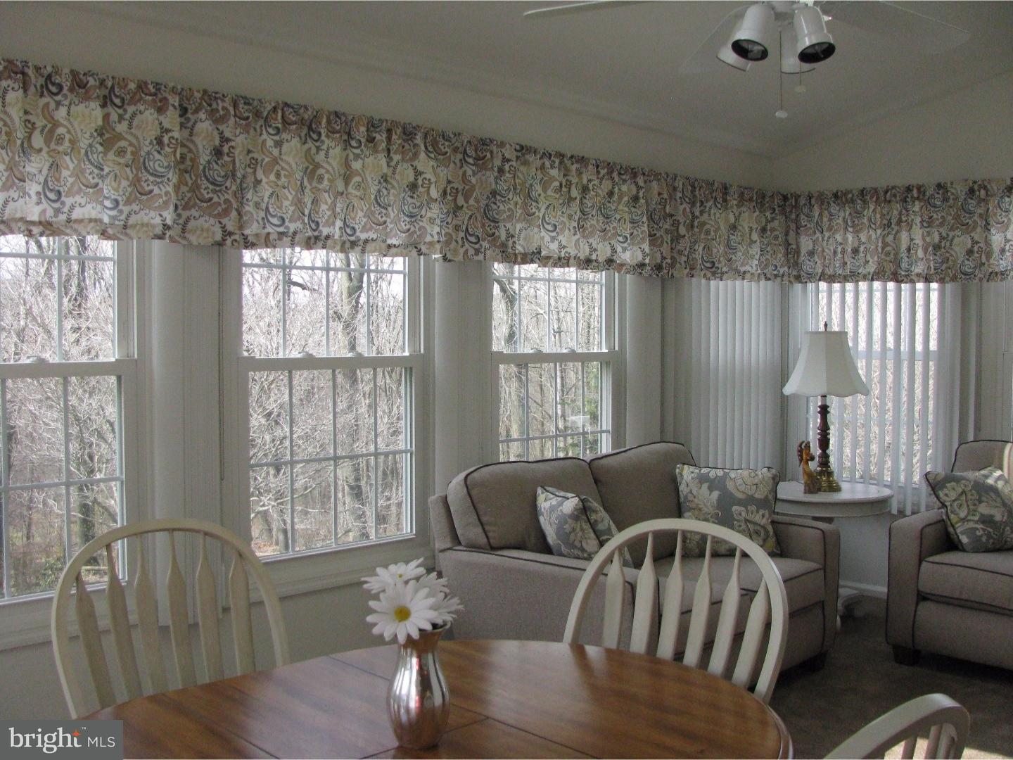 11 Raphael Road Hockessin, DE 19707 - Photo 12 of 25 a living room with furniture and a large window