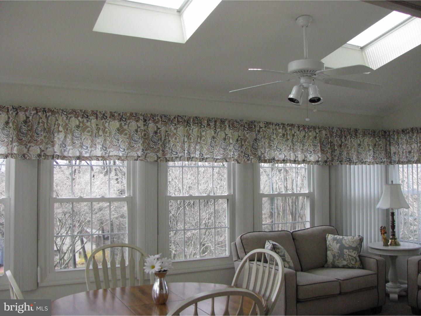 11 Raphael Road Hockessin, DE 19707 - Photo 13 of 25 a living room with furniture and a large window